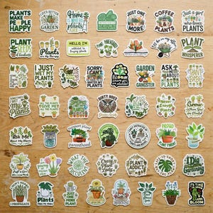 May include: A collection of fifty-six die-cut vinyl stickers featuring various plant-themed illustrations and typography. The designs include potted plants, gardening tools, and humorous phrases like Plants Make People Happy, Plant Whisperer, and Dirty Hoes.