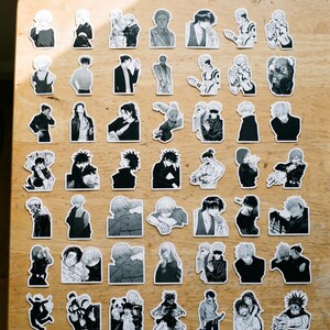 May include: A collection of forty-eight individual black and white vinyl stickers featuring various anime character illustrations from Jujutsu Kaisen, displayed in a grid pattern. Each sticker depicts a different character pose, expression, or scene.