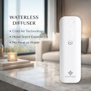 May include: A white waterless diffuser with the text "WATERLESS DIFFUSER" and bullet points: "Cold Air Technology", "Hotel Scent Experience", and "No Heat or Water". The diffuser has a button and the brand name "ESSENTIQUE".