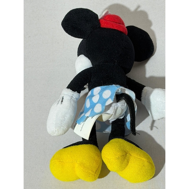 Peluche di Minnie Mouse Disney, gonna a pois blu e cappello rosso con margherite, 20 cm circa. immagine 9
