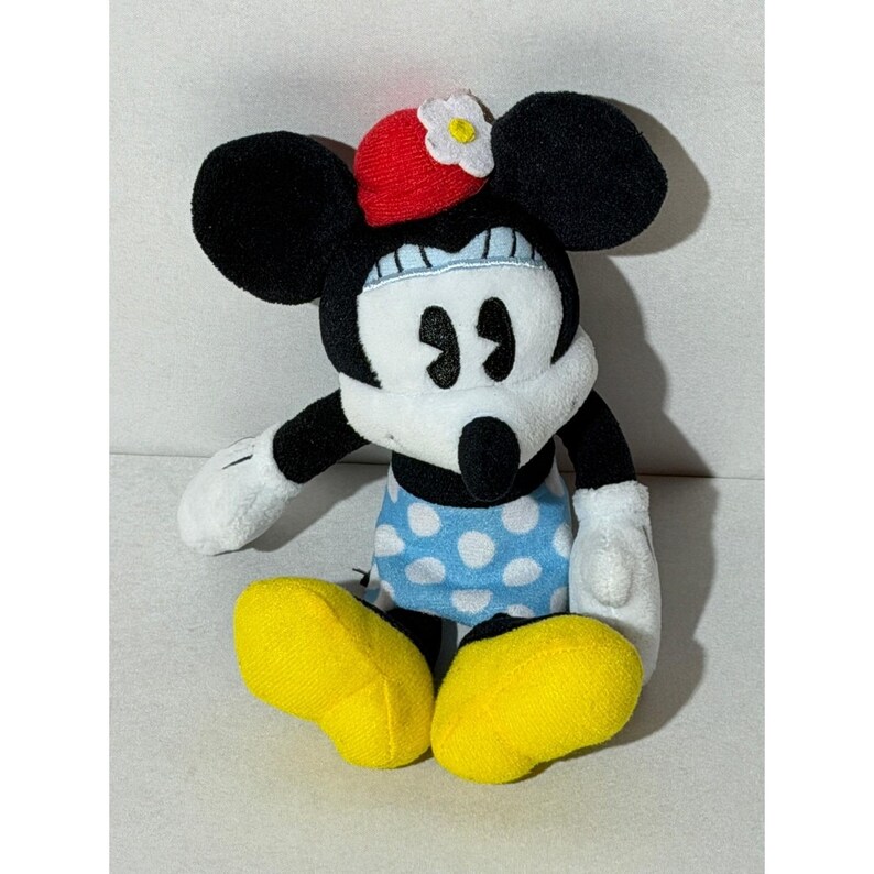 Peluche di Minnie Mouse Disney, gonna a pois blu e cappello rosso con margherite, 20 cm circa. immagine 2