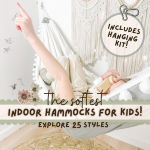 May include: A white indoor hammock for children with a grey trim and white pom-poms. The hammock is suspended from a wall. The image includes the text "The softest indoor hammocks for kids!" and "Explore 25 styles."