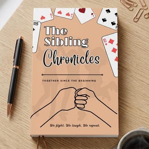 May include: A hardcover book titled "The Sibling Chronicles" with playing card illustrations. The cover features two fists bumping, the text "Together Since The Beginning", and the phrase "We fight. We laugh. We repeat."