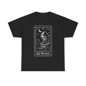 May include: Black t-shirt featuring a white graphic of a skeleton in a hoodie working on a laptop, framed by stars and a crescent moon. The text "The Burnout" is at the bottom of the graphic. A casual, comfortable tee.