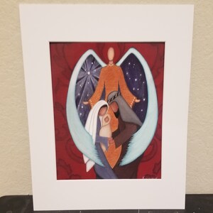 May include: A painting of the Holy Family with an angel's wings surrounding them. The angel is depicted in orange, the mother in blue, the father in gray, and the baby in white. The background is a deep red with a star in the sky.
