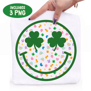 May include: White square with a green outline of a smiley face. The eyes are green shamrocks, and the background is filled with rainbows, horseshoes, and stars. The text "INCLUDES 3 PNG" is in a green oval in the upper left corner.