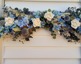 Horizontal Flower Swag with eucalyptus thistle white roses and blue flowers