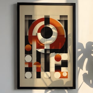 May include: Framed abstract art print featuring geometric shapes in black, white, and shades of orange. The design includes circles, squares, and lines, creating a modern, eye-catching composition. The artwork is framed in a black border.