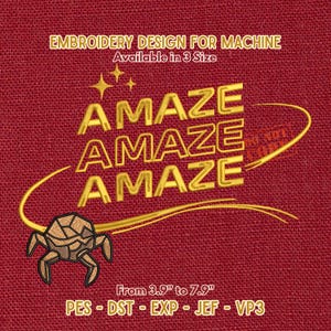 May include: Red fabric background with gold text that reads "AMAZE" three times. The text is in a bold, blocky font. Below the text is a small, stylized crab. The text "EMBROIDERY DESIGN FOR MACHINE" and "Available in 3 Size" are at the top. The text "From 3.9" to 7.9"" is at the bottom.