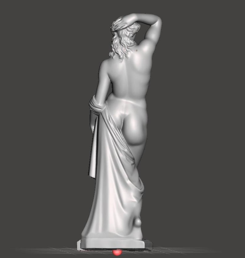 May include: A white sculpture of a nude figure, viewed from the back. The figure has long hair and is draped with fabric. The sculpture is on a rectangular base.