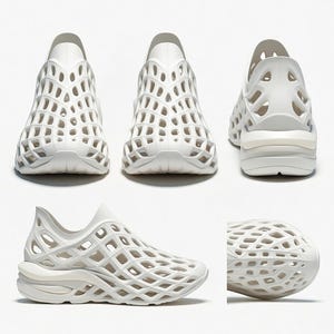 Op de afbeelding: Witte sportschoenen met een uniek kooi-achtig ontwerp. De schoenen hebben een ronde neus en een dikke zool. Het bovenste deel van de schoen heeft een open, roosterachtig patroon. De schoenen worden vanuit meerdere hoeken getoond.