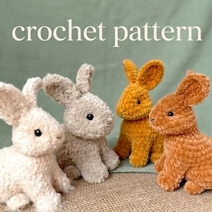 May include: Four crocheted bunny rabbits in cream, grey, gold, and brown. The bunnies have large ears and black bead eyes. The words "crochet pattern" are written in white across the top of the image.