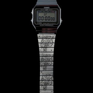 May include: A digital Casio watch with a black face and a silver band. The watch face displays "00:0000" and the text "CASIO". The silver band features engraved tiger faces. The watch is water resistant and has an alarm chronograph.