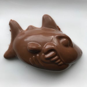 6 Solid Chocolate Sharks individually wrapped approximately 1/4 pound of chocolate each