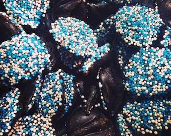 Chocolate non pareils made by hand, milk chocolate or dark chocolate or white chocolate