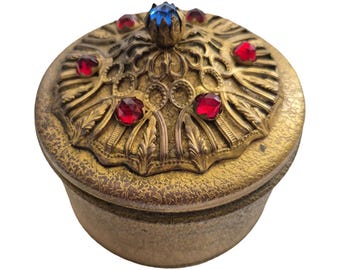 Art-deco opbergdoosje met juwelen in poedervorm