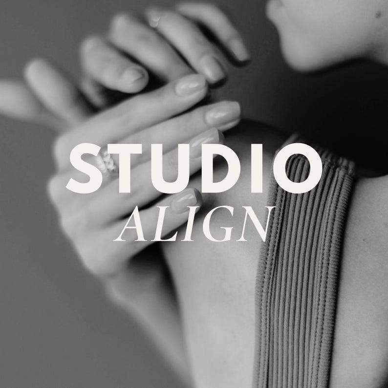 May include: Black and white image featuring the text "STUDIO ALIGN" overlaid on a person's hands and shoulder. The hands are gently touching, with one hand wearing a ring. The person is wearing a ribbed top.