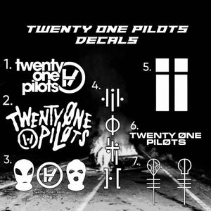 May include: A collection of seven white Twenty One Pilots decals on a black background. The designs include band logos, text, ski masks, and abstract symbols numbered one through seven, featuring the text Twenty One Pilots and Twenty Øne Piløts.