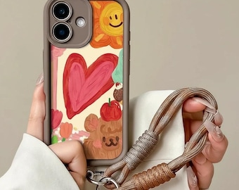 Custodia per iPhone con motivo a cuori e cinturino da polso, cover per telefono in morbido silicone