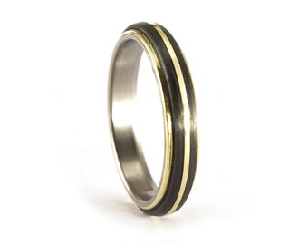 Titanium and yellow gold 18K ring with matte carbon fiber band. Black and gold wedding ring. Rounded engagement ring (00559_4N)