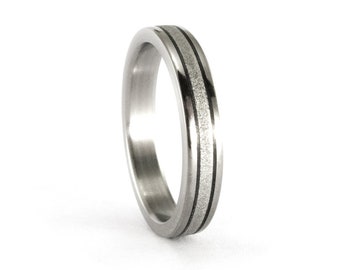 Titanium and carbon fiber flat ring for her. Sandblasted and polished womens wedding band with carbon fiber inlays. (00343_4N)