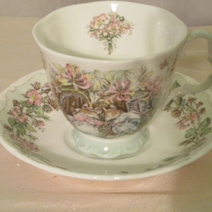 Signed Royal Doulton Tea Cup and Saucer