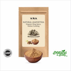 May include: A brown paper bag with a label that reads "NATURAL ASAFOETIDA Organic Hing Spice, Indian Cooking." A wooden bowl contains a pile of brown spice. The image also includes the text "BKPSONSETSYSHOP" and "Natural n Tasty."