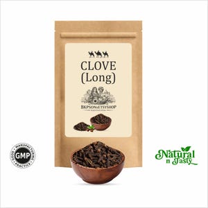 May include: A brown paper bag with a label that reads "CLOVE (Long)" and a wooden bowl filled with cloves. The label also features an illustration and the text "BKPSONSETSYSHOP RAJASTHAN INDIA". The words "Natural n Tasty" are also visible.