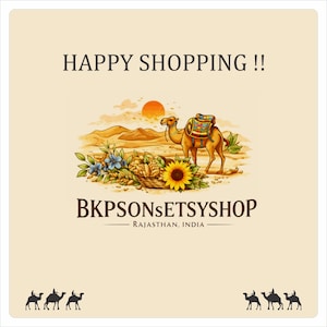 May include: An illustration with a camel wearing a colorful saddle, set against a desert landscape with a rising sun. The image includes a basket of flowers and the text "HAPPY SHOPPING !!" and "BKPSONSETYSYSHOP RAJASTHAN, INDIA".