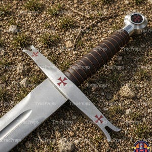 May include: A steel sword featuring a brown leather-wrapped grip with a silver pommel and crossguard. The crossguard and pommel are decorated with red cross symbols. The blade is straight with a central fuller running down the length of the metal.