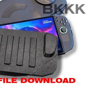 May include: A black Lenovo Legion handheld gaming device with a protective case and a black holder. The screen displays a colorful graphic. The text "STL FILE DOWNLOAD" is in red.