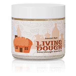 May include: A clear glass jar with a white lid, containing a sourdough starter. The label features a cartoon bread house and the text "Soviet Rye Living Dough Sourdough Starters."