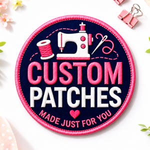 May include: A circular embroidered patch with a dark blue background and a bright pink border. It features a white sewing machine, a pink thread spool, and a needle. The text reads CUSTOM PATCHES in pink and white, with MADE JUST FOR YOU below.