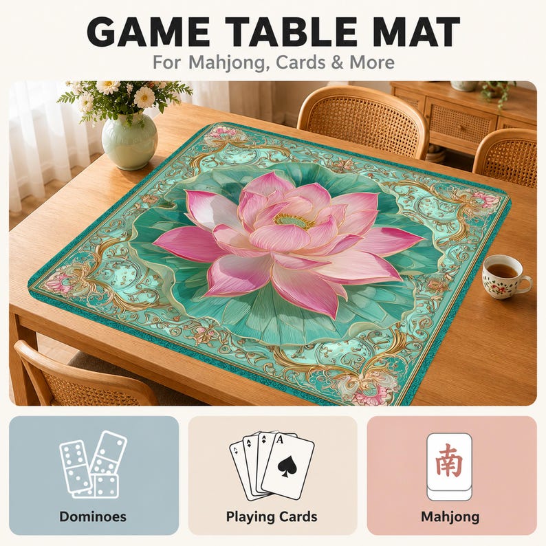 May include: A square game table mat featuring a large pink lotus flower centered on a teal background with ornate gold filigree borders. The text GAME TABLE MAT For Mahjong, Cards & More appears above, with icons for dominoes, cards, and mahjong tiles below.