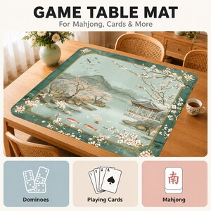 May include: A rectangular game table mat featuring a printed landscape with a pavilion, cherry blossoms, and koi fish. The text GAME TABLE MAT For Mahjong, Cards & More is visible, along with icons for dominoes, playing cards, and mahjong tiles.