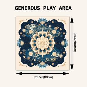 May include: A square play mat featuring a central cream-colored mandala design surrounded by dark blue floral and wave patterns. The text "GENEROUS PLAY AREA" is printed above. Arrows indicate dimensions of 31.5 inches by 31.5 inches on all sides.