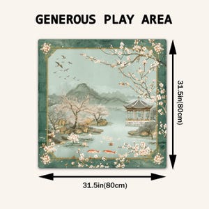 May include: A square play mat featuring a landscape illustration with a pavilion, cherry blossoms, and koi fish. The text 'GENEROUS PLAY AREA' is at the top. Measuring tape indicators show dimensions of 31.5 inches by 31.5 inches on the sides.