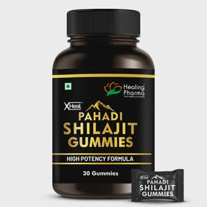 May include: A black bottle of Pahadi Shilajit Gummies with a black cap and gold lettering. The bottle has the text "XHeal" and "Healing Pharma" with the words "Pahadi Shilajit Gummies" in gold. A single gummy packet is next to the bottle.
