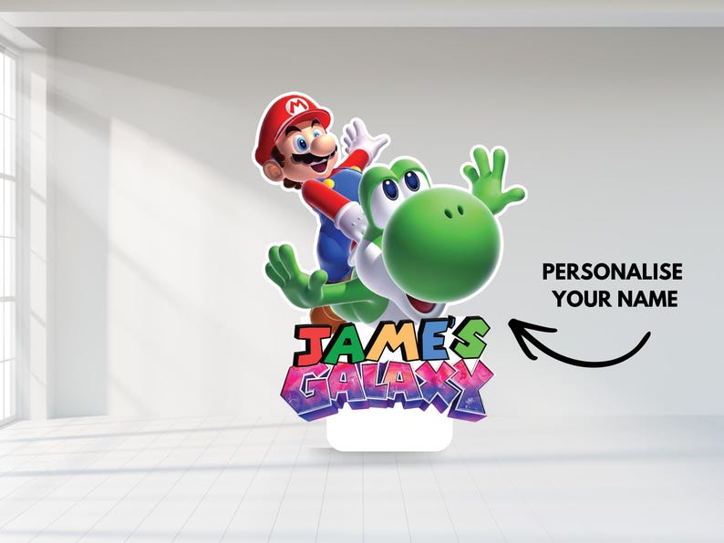 May include: A colorful stand-up decoration featuring Mario riding Yoshi. The design includes the text "JAMES'S GALAXY" in vibrant colors and the option to personalize with a name. The characters are set against a white background.