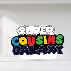 May include: A colorful graphic with the words "SUPER COUSINS GALAXY" in a 3D style. The word "SUPER" is outlined in white, while "COUSINS" is in blue, yellow, red, and green. "GALAXY" is in dark blue.