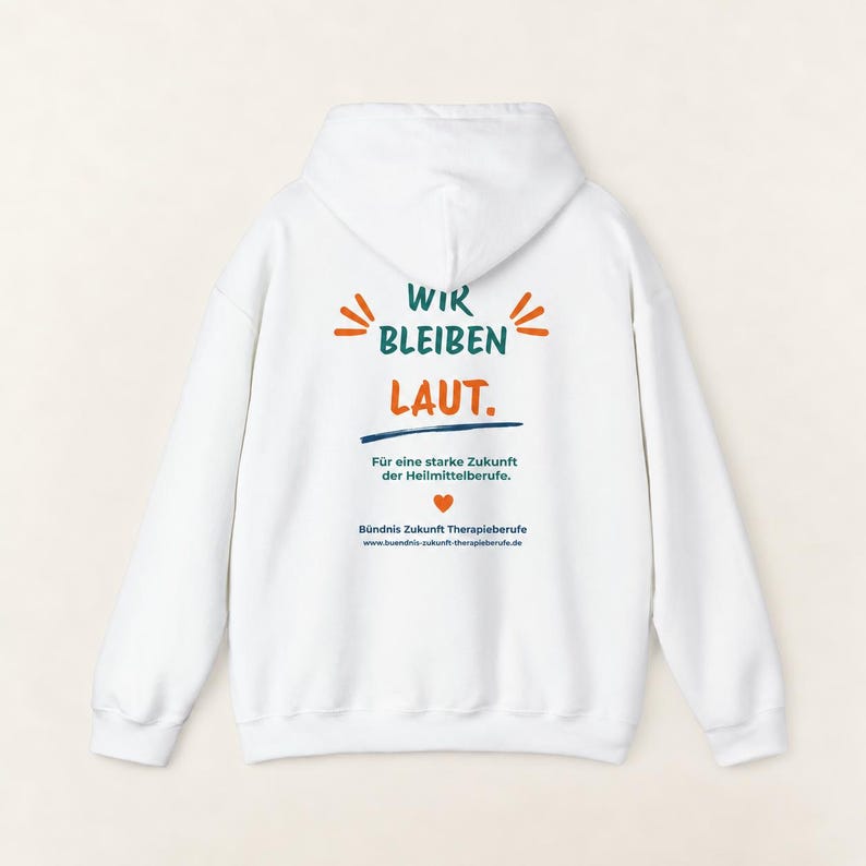 May include: A white hooded sweatshirt featuring back text that reads WIR BLEIBEN LAUT. F&uuml;r eine starke Zukunft der Heilmittelberufe. B&uuml;ndnis Zukunft Therapieberufe, along with a small orange heart icon and the website buendnis-zukunft-therapieberufe.de.