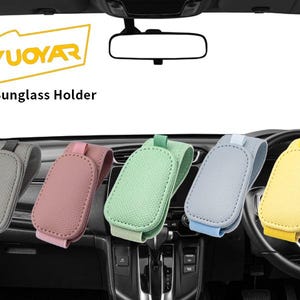 May include: A variety of car sunglass holders in different colors, including black, beige, gray, pink, green, blue, yellow, brown, and purple. The holders are displayed inside a car, with the brand name "YUOYAR" visible.