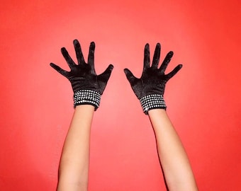 Black satin wrist length gloves with crystal mesh embellishment on cuffs.