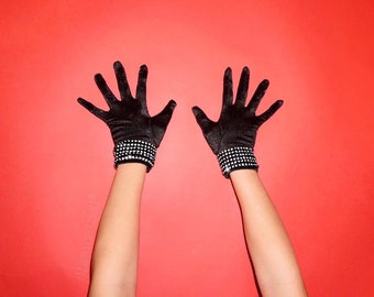 Black satin wrist length gloves with crystal mesh embellishment on cuffs.