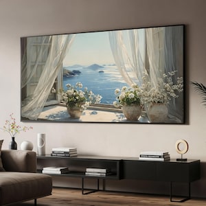 May include: A rectangular wall art print featuring a view through an open window with sheer white curtains blowing in the breeze. Three terracotta pots filled with white flowers sit on the windowsill, overlooking a calm blue sea and distant islands.