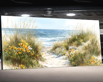 May include: A rectangular canvas print showing a beach scene. A sandy path leads to the sea, bordered by tall grasses and yellow wildflowers. The ocean is blue with white waves under a blue sky, evoking a coastal theme.