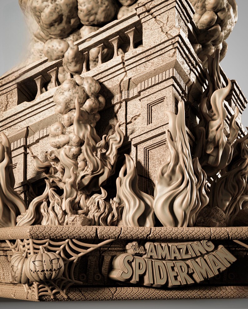 May include: A detailed sculpture of a building engulfed in flames, with the words "The Amazing Spider-Man" carved into the base. The sculpture features a pumpkin and spiderweb design.