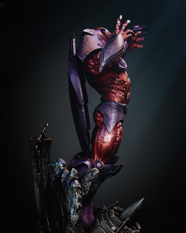 May include: A detailed sculpture of a red-skinned, muscular humanoid figure with purple armor and a helmet. The figure is posed dramatically, with one arm raised and clawed fingers extended. The sculpture is set against a dark background.