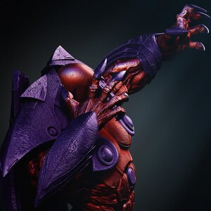 May include: A detailed, close-up view of a creature with a red and purple color scheme. The creature has sharp claws, armored plating, and a menacing posture. The image is set against a dark background, highlighting the creature's features.