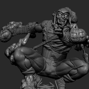 May include: A grayscale sculpture of a menacing figure in a crouched pose, holding two carved pumpkins. The character wears a hooded outfit, with a belt and textured leggings. The figure's face is contorted in a sinister grin.